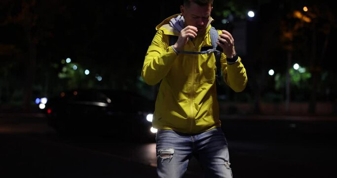 Emotions of sadness man reads message and dejectedly sit down on street and hold on to head. Bad news financial loss and online breakup