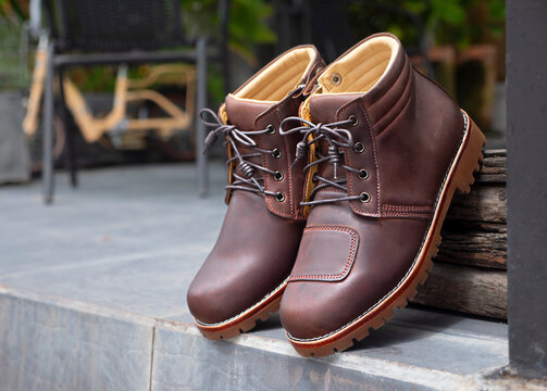 Man fashion brown boot leather on the floor.