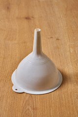a white plastic funnel