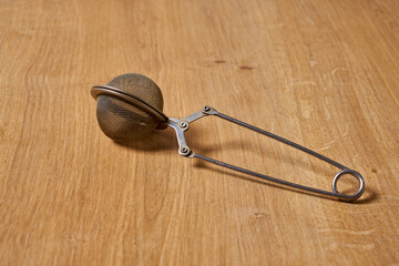 a metallic tea strainer