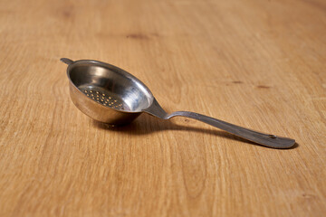 a metallic tea strainer