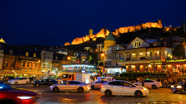 Tbilisi - Georgia - 7-28-2023 Vibrant Old Tbilisi: Colorful Mountain Buildings, Church and teleferique cable car and Lady of Georgia Close-Up , The Architectural Detail of Old Tbilisi Night life