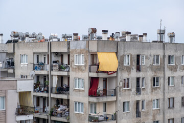 Water tanks on the roof of a residential building in Antalya, Turkey. Housing and communal services in the Turkish town. Streets and houses with water tanks on the roof to heat hot water.