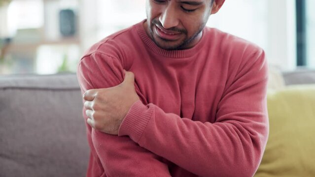 Arm, shoulder and pain of man in home with stress, joint inflammation and arthritis risk. Health, injury and closeup of person with muscle ache, wound and anxiety for first aid, fracture or emergency