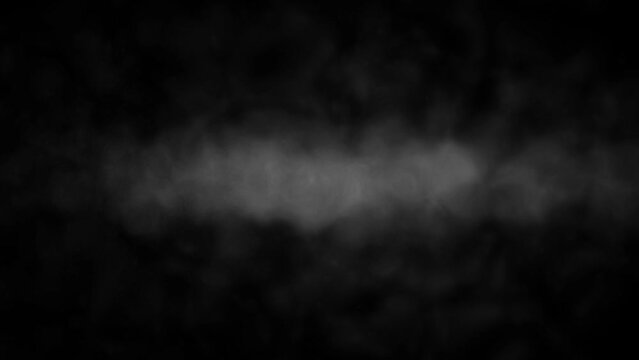 Smoke vapor fog creating an atmospheric effect on a black background.
