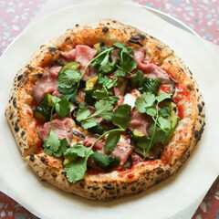 Pizza with roast beef and cilantro