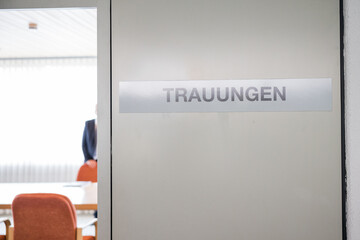 A room designated for civil marriages at a German city hall with a sign saying "Trauungen" meaning civil marriages 