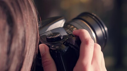 A skilled photographer adjusts focus and captures moments with expert precision.
