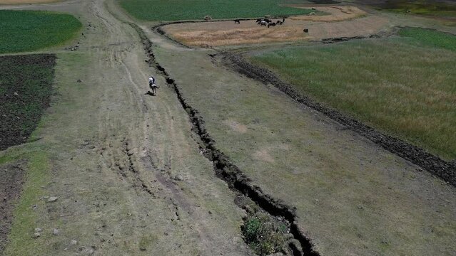 Aerial view of man riding a horse in the highlands AmharaWeldiya Ethiopia