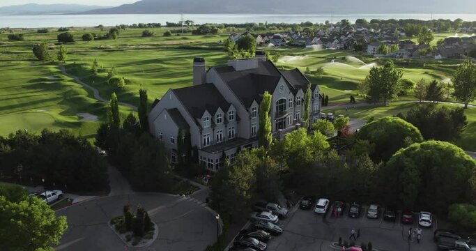 Orbit above sleepy ridge golf course clubhouse, utah lake and vineyard behind