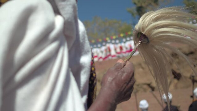 Ethiopian orthodox priests in line celebrating TimkatAmharaLalibela Ethiopia