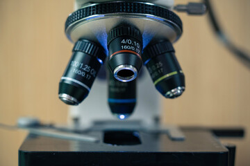 Naklejka na ściany i meble Microscope close-up in the laboratory using metal lenses.