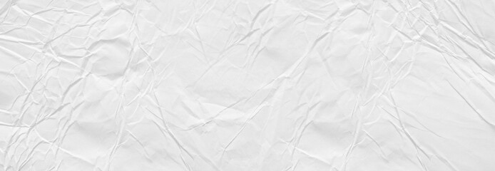 Creative background with scattered overlay of crumpled white paper.	