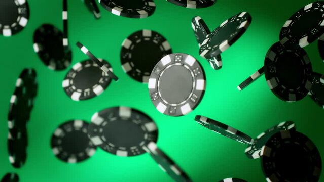 Super Slow Motion Shot of Casino Chips Explosion Towards Camera on Green Background at 1000fps.
