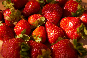 Fresh and juicy organic strawberries on chefs table.