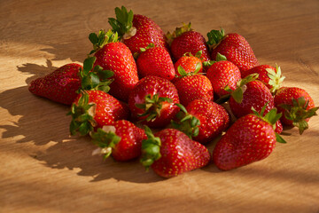 Fresh and juicy organic strawberries on chefs table.
