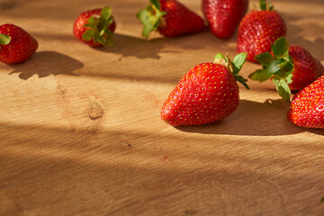 Fresh and juicy organic strawberries on chefs table.