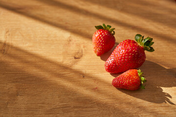 Fresh and juicy organic strawberries on chefs table.