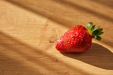 Fresh and juicy organic strawberries on chefs table.