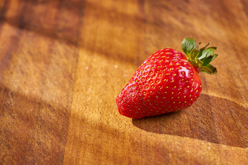 Fresh and juicy organic strawberries on chefs table.