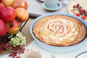 apple pie on laid table in  garden on sunny day