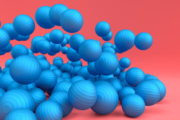 Many of flying blue fitness ball or fitball falling on pink background