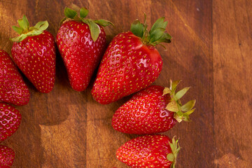 Fresh and juicy organic strawberries on chefs table.