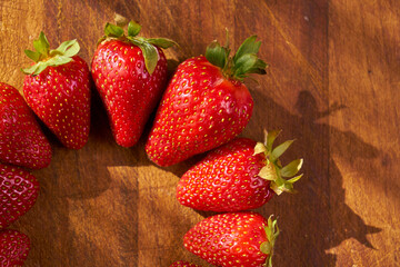 Fresh and juicy organic strawberries on chefs table.