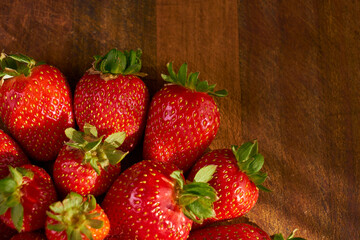 Fresh and juicy organic strawberries on chefs table.