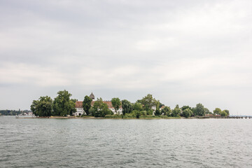 Fototapeta na wymiar Fraueninsel island on the Cheimsee Lake in Bavaria, Germany on a cloudy day