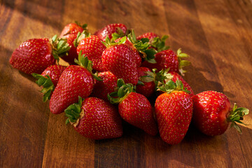 Fresh and juicy organic strawberries on chefs table.