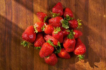Fresh and juicy organic strawberries on chefs table.