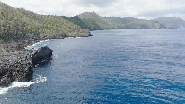 Coast and shore of Cabo Cabron national park In Samana peninsula, Dominican Republic. Aerial drone forward view