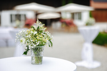 Beautiful flower decoration on a table at a wedding reception