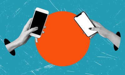 Two hands holding cell phones transfer money between accounts. Transferring money using an electronic wallet.