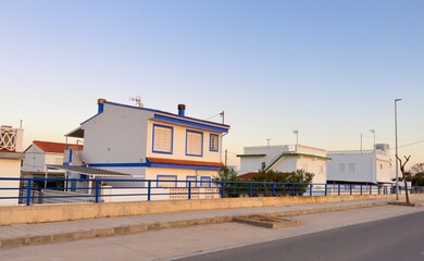 House at sea with pavement road. Suburb house building Exterior. Villa at seaside for holiday. Facade of house with Garden. House Exterior at coast. Residential home building for vacation on sea.