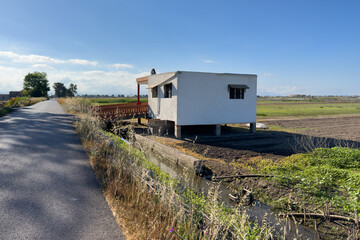 Farm building near farm field. Rural landscape. Farm house on farmland. Old Home in Spain countryside.