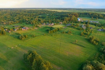 Rural landscape. Country houses in countryside. Village Home in Country. Wooden house in Russian...