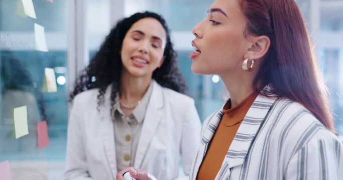 Business women, communication and brainstorming on glass in office for calendar, agenda and planning ideas. Team talking at window for schedule, timeline and mindmap for mission, feedback and process