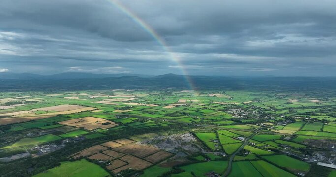 A half of rainbow over a field in Kilkenny Ireland 4k