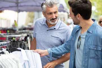 young hipster brothers at weekly cloth flea market