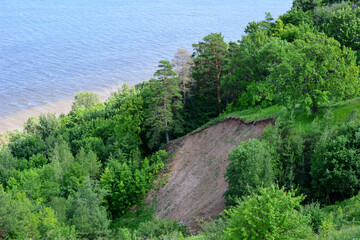 Fototapeta na wymiar cliff with green forest and river on background copy space 