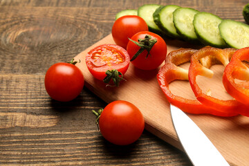 Vegetables, herbs and spices. Salad preparation ingredients on brown table