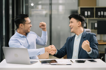 Happy smiling businessman feel happy work complete Teamwork success, success at work in the office concept.