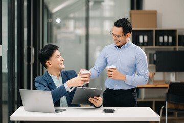 Portrait of success business people working together in office. Couple teamwork startup concept
