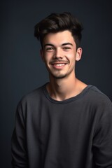 Fototapeta premium studio shot of a young man posing against a gray background