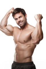 Fototapeta premium shot of a man flexing his muscles against a white background