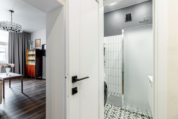 White modern interior door in an apartment with a simple interior