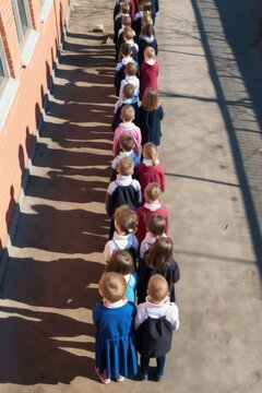 High Angle Shot Of A Group Of School Children Standing In A Row