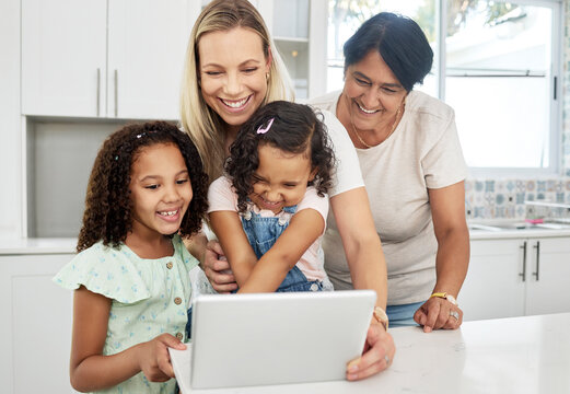 Blended family, adoption and a girl with her mother on a tablet in the kitchen for education or learning. Children, diversity or study with a parent and granny teaching girl kids at home together